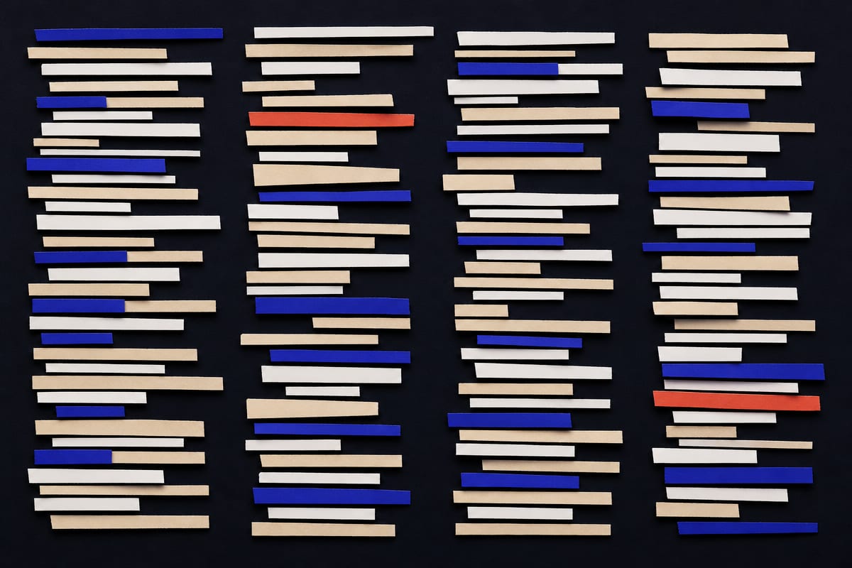 A dense field of thin cut-paper strips of many different lengths, stacked in ragged columns